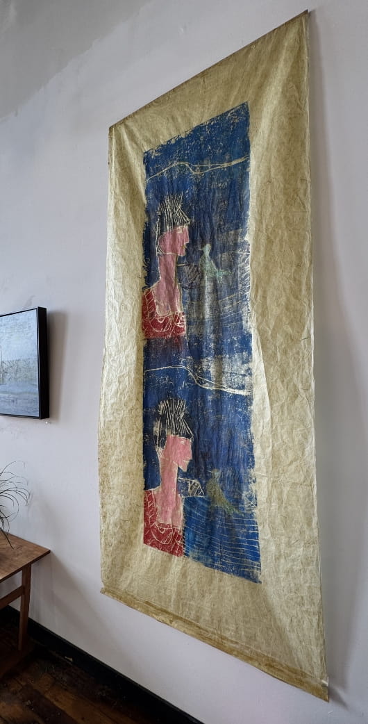 A piece of painted art hung at a Kilburn Mill Studio