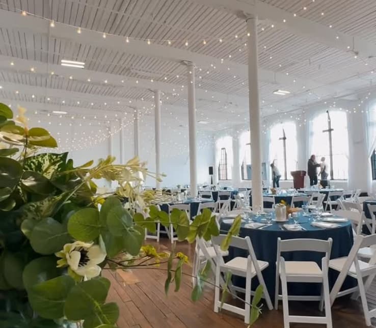 wedding events_set2_photo2 beautiful flowers and chairs at the event hall at Kilburn Mill